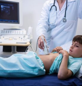 Female doctor doing ultrasound for patient at hospital